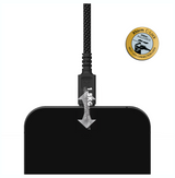 A black rectangular electronic device with a braided black cable plugged into it, shown on a white background with a gold Storm C-Lock certification badge and a silver arrow labeled 1.5KG dropping weight.